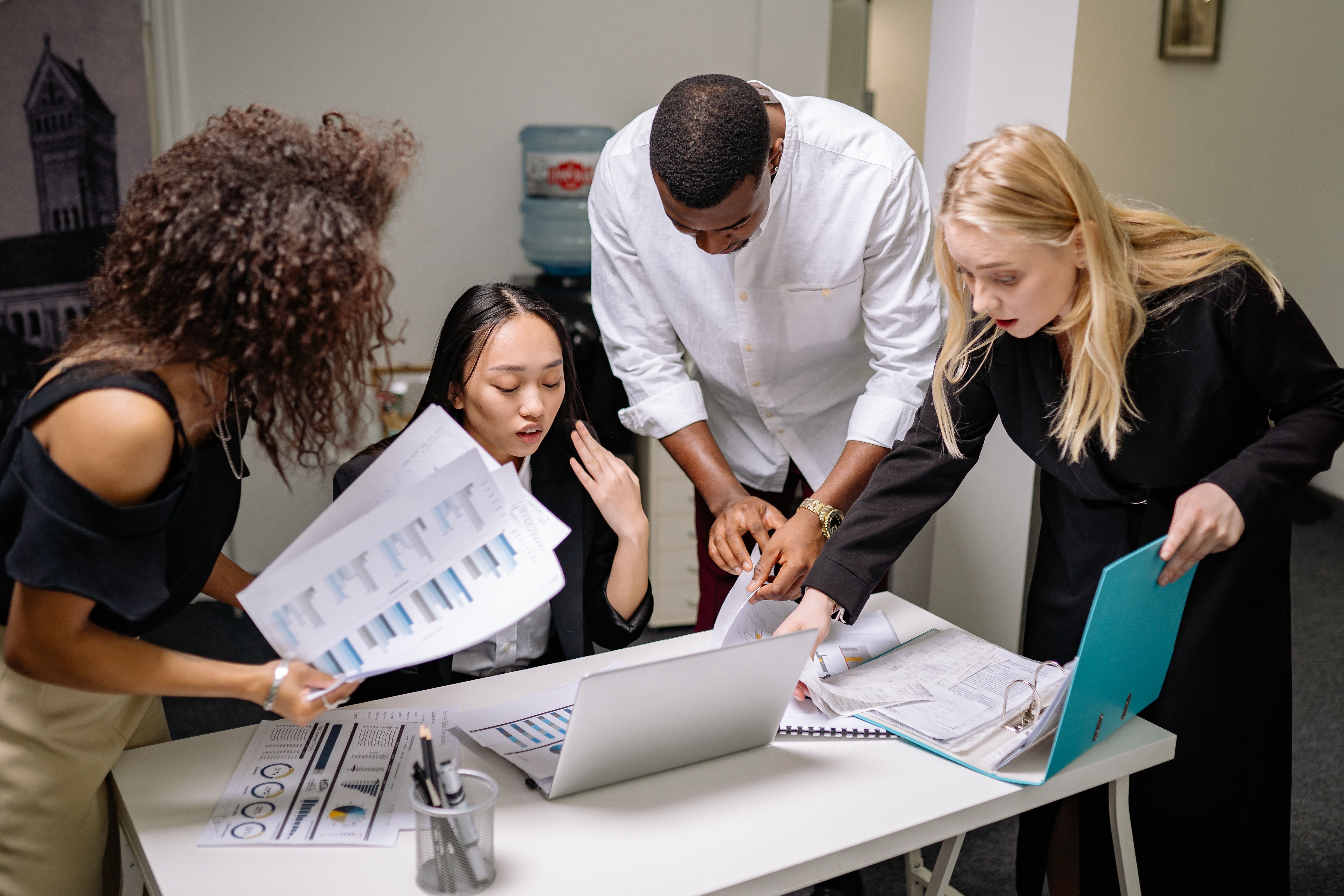 Human resources professionals reviewing employee documents